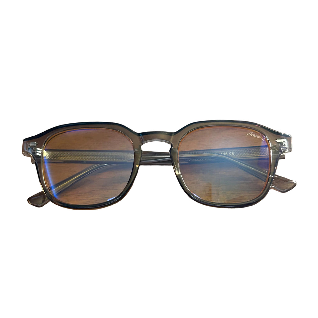 Eyeglasses on a wooden surface with a white background