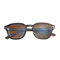 Eyeglasses on a wooden surface with a white background